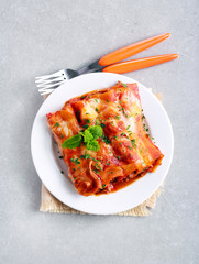 Beef cannelloni with tomato sauce