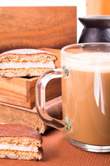 Glass mug with hot chocolate on a table