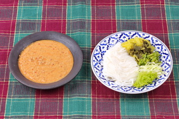Rice noodle and fish curry in coconut milk with herb.