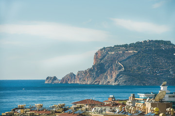 View over Alanya castle hill and Mediterranean sea from Tosmur district on clear day, Turkey