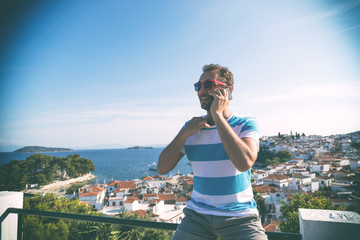 Modern man using smartphone.

