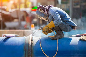 Arc welder with welding sparks, outside

