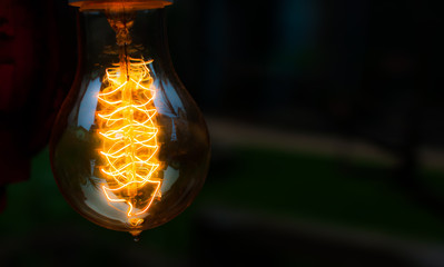 Big Glowing Led filament cob Electric lamp in dark tone on black