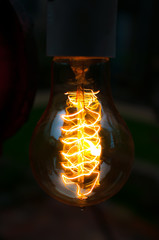 Big Glowing Led filament cob Electric lamp in dark tone on black