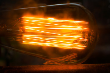 Big Glowing Led filament cob Electric lamp in dark tone on black