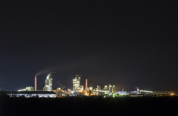 Fototapeta na wymiar Panorama view of cement plant and power sation at night in Ivano