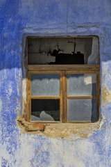 Old window frame in a vintage bricks wall in a rural romanian house.
Old wall with window detail of an old building in ruins.