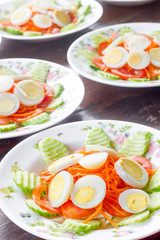 Fresh vegetable salad  and boiled egg in a bowl.