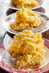 Fried shredded rice grain with banana.Thai dessert