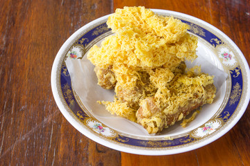 Fried shredded rice grain with banana.Thai dessert
