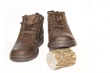Brown man's leather boots isolated on white background.