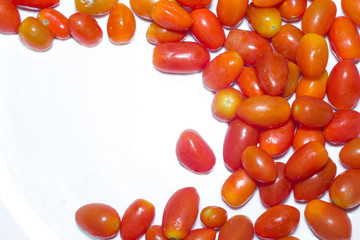 Small tomato vegetables isolated on white background.