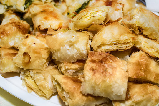 Traditional Serbian cheese pie gibanica and spinach pie in plate