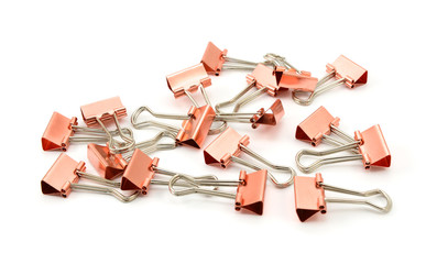 Copper-coloured metal binder clips
