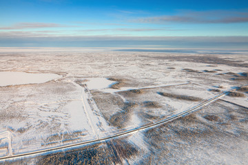 Highway in winter tundra, top view