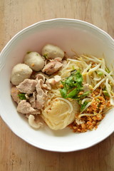 dried thin rice noodle with pork ball and boiled meat on bowl