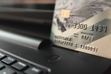 Closeup view of credit cards on laptop keyboard. online shopping