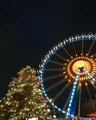 Christmas tree and illuminated great wheel at Berlin's Christmas market