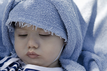 Beautiful baby playing on the sand in Bulgarian resort