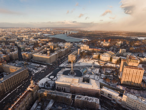 Aerial view of Independence Square (Maidan Nezalezhnosti) at sunset time. Winter stormy clouds on background over city of Kiev, Ukraine. 