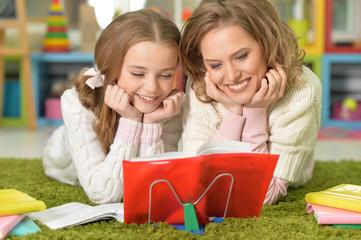 Mother helps with homework