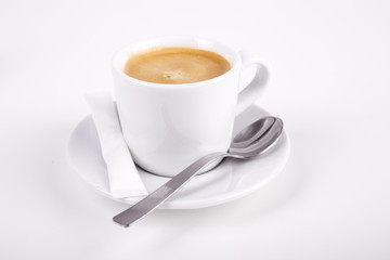 white cup of coffee with spoon