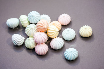 meringues on gray background
