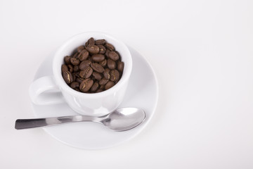 white cup of coffee with spoon