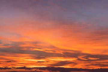 Cloudy sky orange yellow.