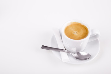 white cup of coffee with spoon