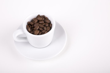 cup of coffe with beans on white background