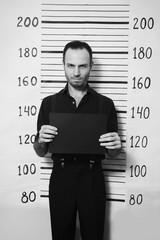 Portrait of criminal man on detective party