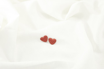 Obraz na płótnie Canvas Love Valentines Day red heart on off white linen fabric backgrou