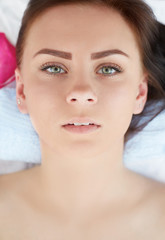 Obraz na płótnie Canvas Closeup of an attractive young woman receiving massage.
