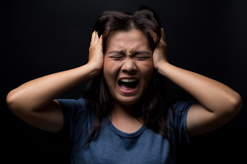 Screaming woman on black background