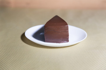 Delicious dark chocolate cake in white plate