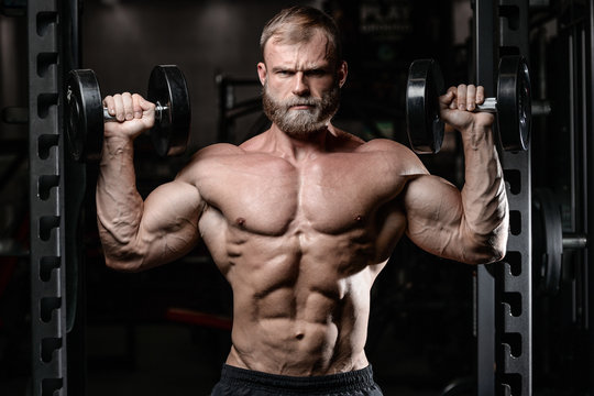 brutal muscular man with beard unshaven fitness model healthcare