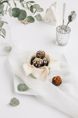 Food Scene of Chocolate Truffles in Small Pot on White Table