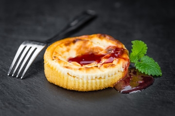 Cheesecake with berry Sacue (selective focus)