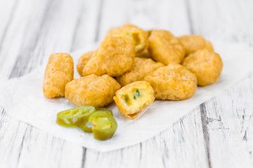 Cheese Nuggets (with Chilis) (selective focus, close-up shot)