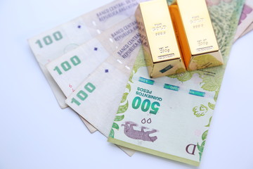 gold bullion and argentine money