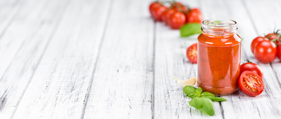 Tomato Sauce (selective focus) on vintage wooden background