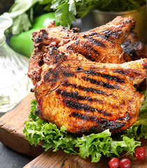 fried pork steak, lettuce on a cutting board