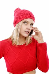 Beautiful young blonde woman with a red cap, phone