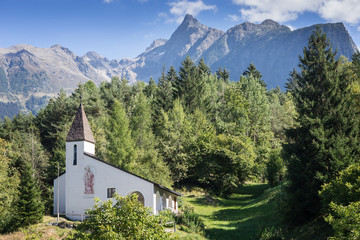 Fototapeta na wymiar Saint Blasius church, wildlife and alps background. Piburg wild mountainous natural, Oetz, Austria, Europe