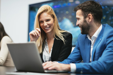 Business colleagues working in office