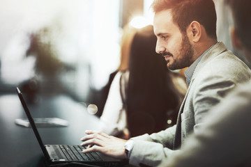 Programmer working in office on laptop