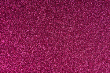 Glittering magenta paper sheet texture background. Sparkling golden red wine color pattern.