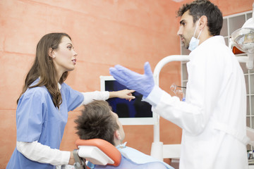 Young man having dental chekup at dentist office