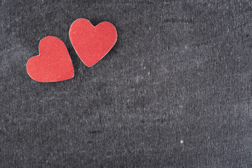 Obraz premium Red heart paper on black chalk board art abstract background hol